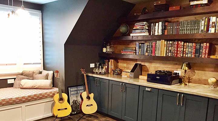 builtin storage cabinets and floating shelves in home office